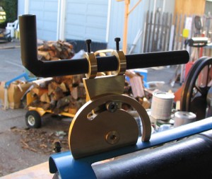 Photo #3: How to bond plastic mirror to steel pipe? Gorilla Glue did the trick. Here’s the final incarnation, with mirror ground to match contours, then tube painted black and secured in two brass rings, via setscrews. The largest thread I could cut in this thickness was 6-32 but I trust #5-40 more so all fasteners are this size. No magnification or crosshairs, but it does let me see downrange without breaking my neck! Once I have an idea of ranges I’ll scribe lines on the movable bits.