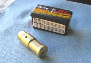 Photo #8: Here’s the bad boy, fresh off the lathe. I bored it .177″ plus a smidge, using a #16 drill. Box of pellets (I couldn’t find any BBs!!) for scale. I loaded a pellet, put 70psi shop air to the 5/64″ touch hole and THWACK! Pellet shot clear across the shop; very promising, yes?